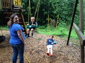 Brooke and her boys swinging on the swingset.